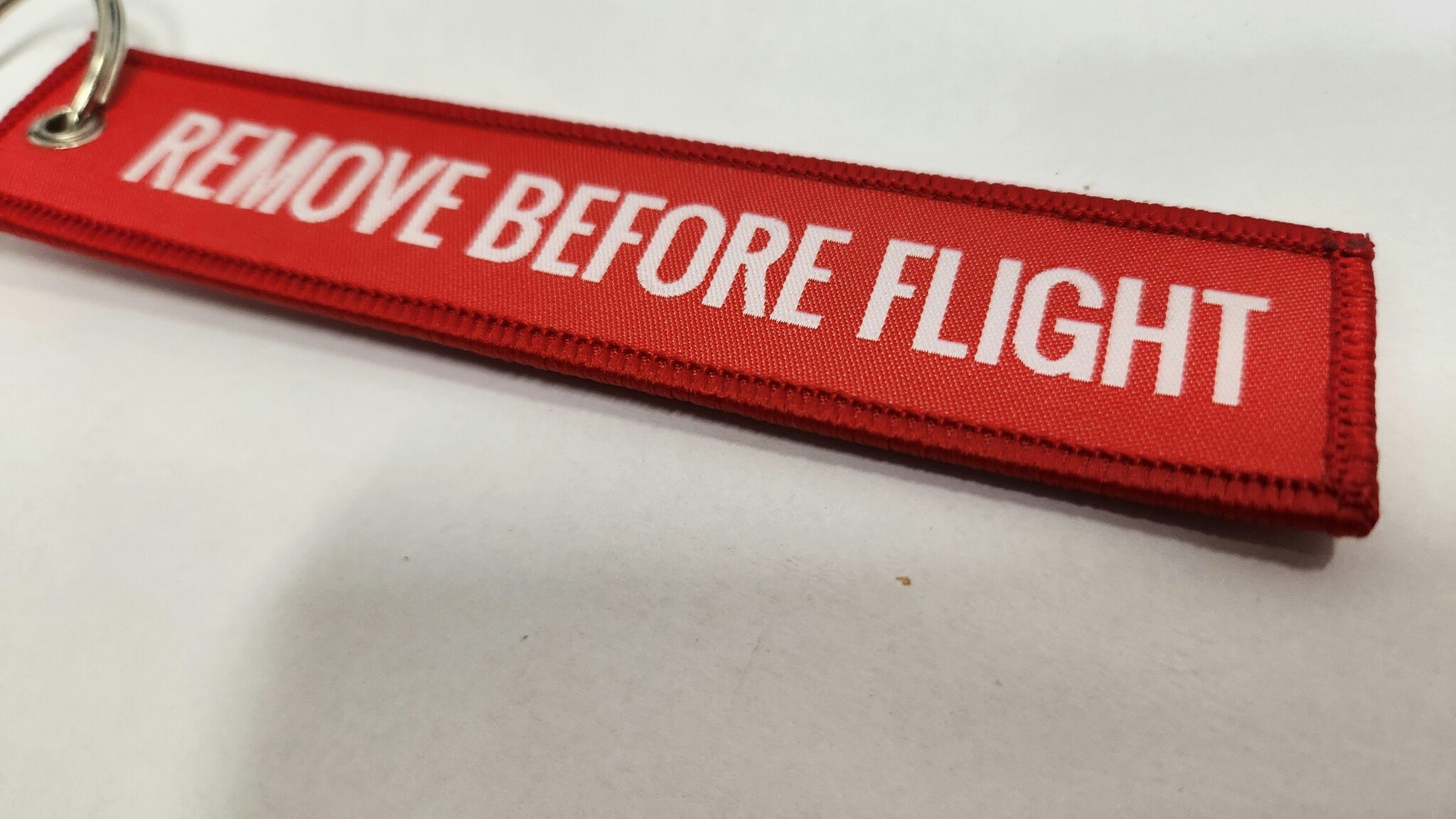NYCKELRING "Remove before flight" Röd 1st