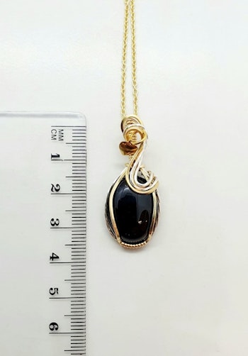 Halsband Swirly i 925 sterlingsilver och mässing med svart agat