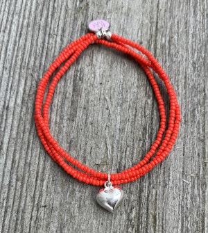 Tre armband i ett, rött