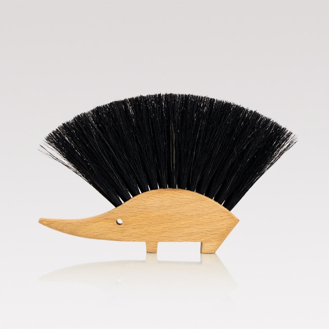 wooden brush shaped like a hedgehog with horsehair bristles