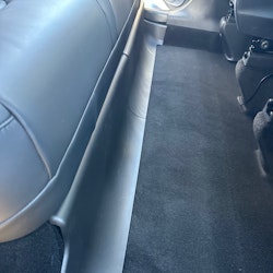 Antikick to the back seat, lower edge - Tesla Model Y
