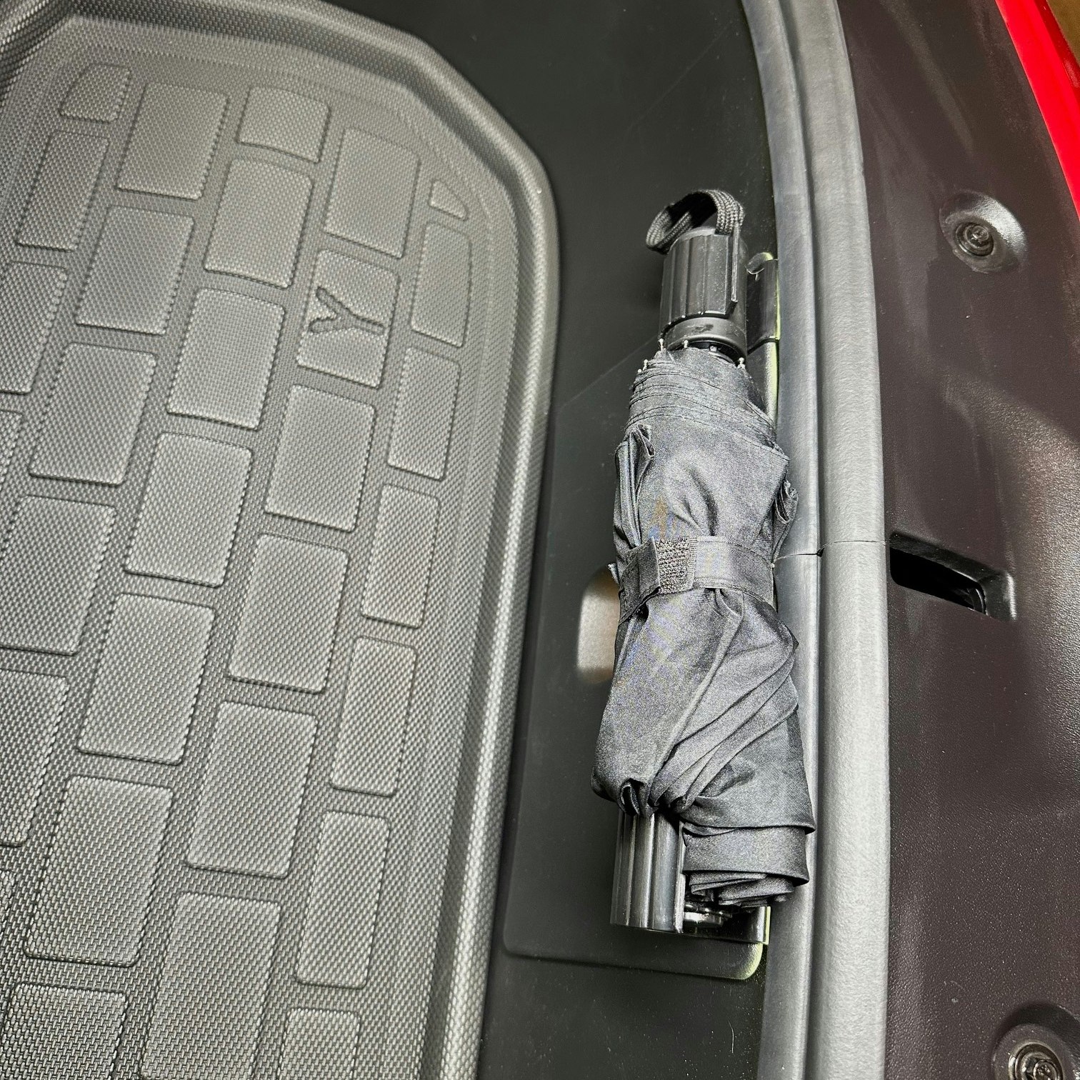 Umbrella hooks in the front - Tesla Model Y