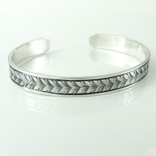Handgraverat armband: Running leaf