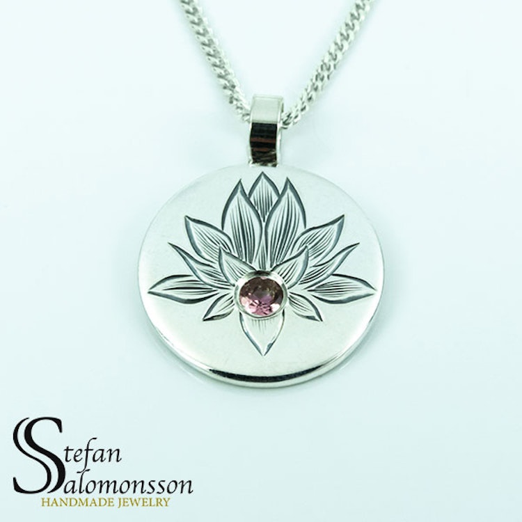 Hand-engraved lotus pendent in silver with a tourmaline