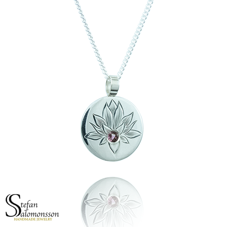 Hand-engraved lotus pendent in silver with a tourmaline