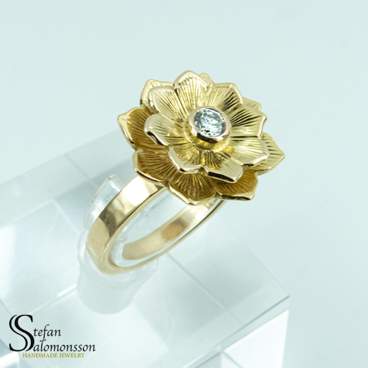 Gold lotus ring with a diamond