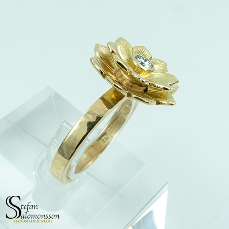 Gold lotus ring with a diamond