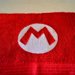 Gästhandduk - Super Mario logo