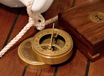 Compass and sundial in wooden box