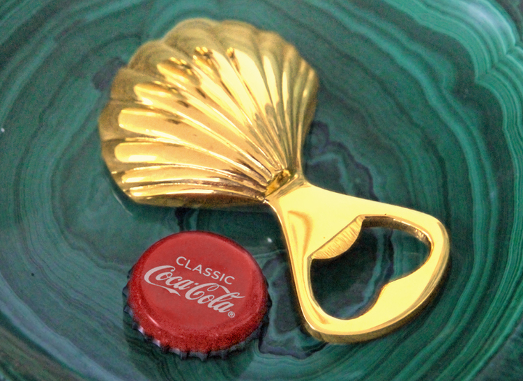 Bottle opener in the shape of seashells