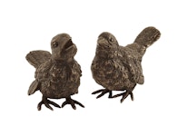 Litet par fåglar gjorda i brons