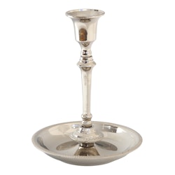 Candlestick in nickel-plated brass that can be made into a tall or low candlestick