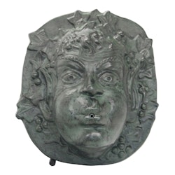 Fountain for wall with cherub face green patinated