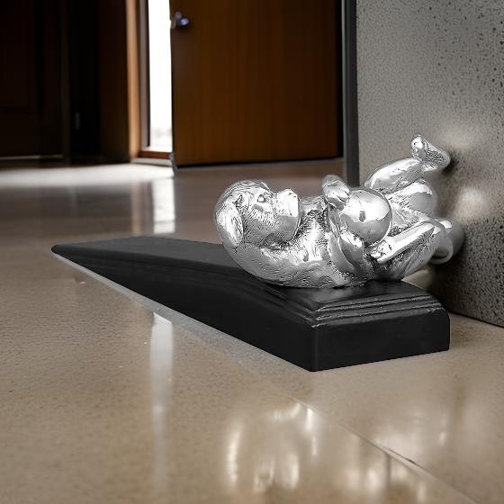 Door stop with dog playing with ball in silver- silver