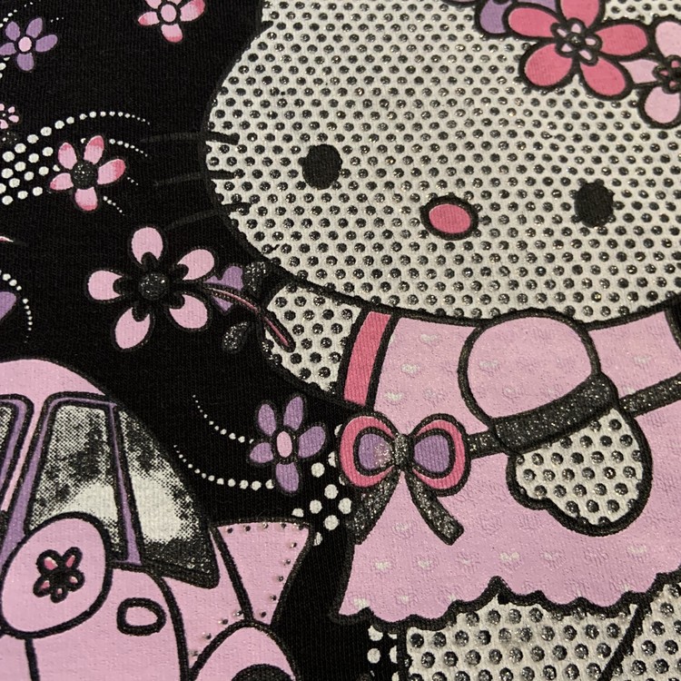 Svart t-shirt med rosa, lila och vitt glitter tryck med Hello Kitty stl 104