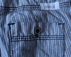 Mörkblå- och vitmönstrade byxor från Newbie stl 92