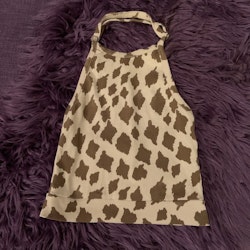 Beige halterneck linne med bruna giraffläckar från Mini Rodini stl 104/110