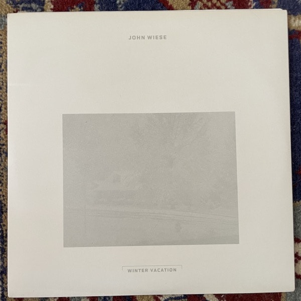 JOHN WIESE Winter Vacation (White vinyl) (The Blue Sky Writings - USA original) (EX) 7"