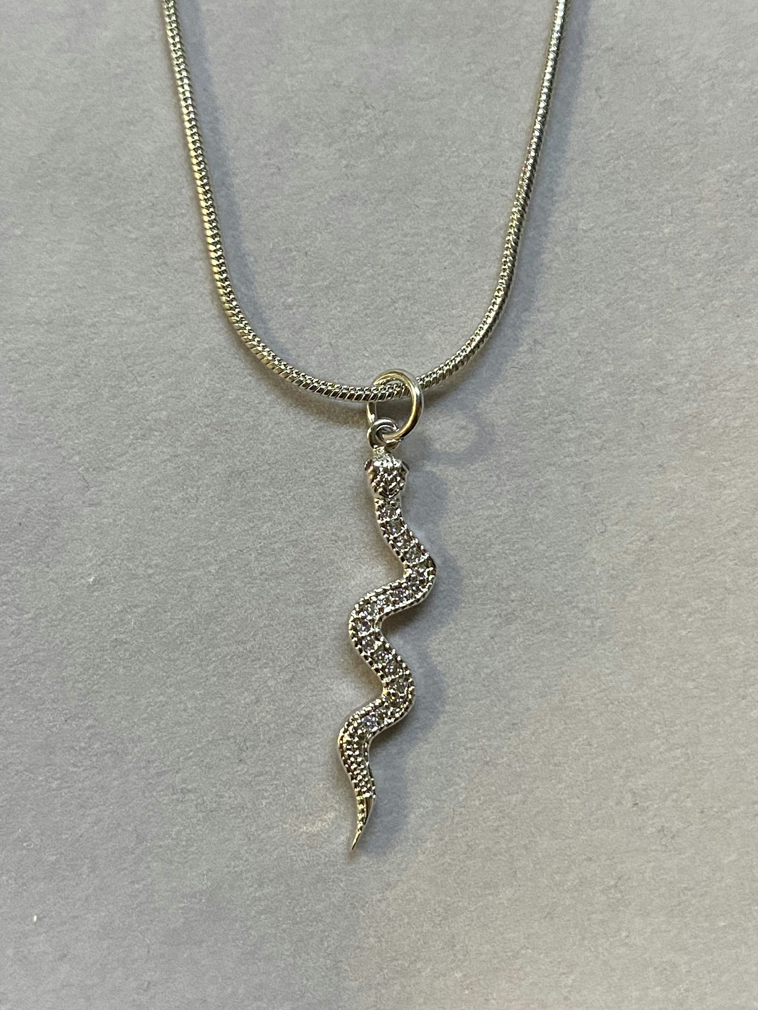 Snake charm necklace