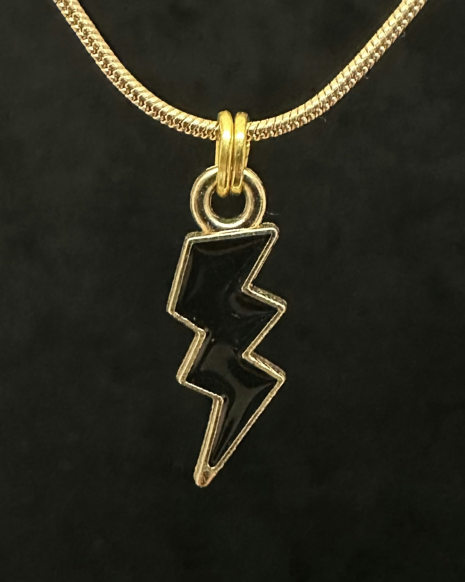 Black lightning charm necklace