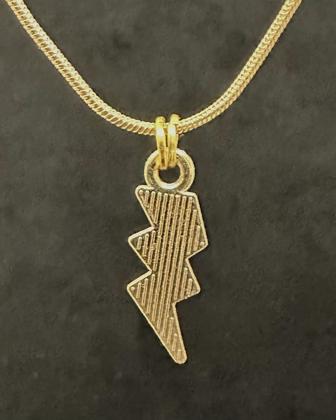 Black lightning charm necklace