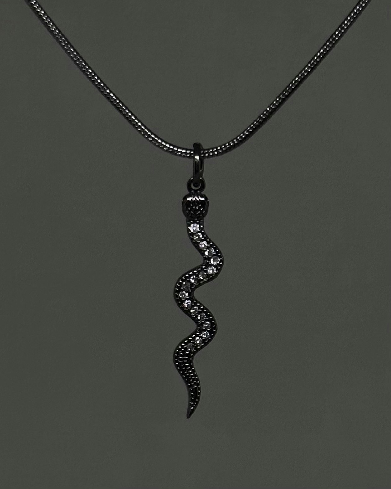 Snake jewelled charm necklace
