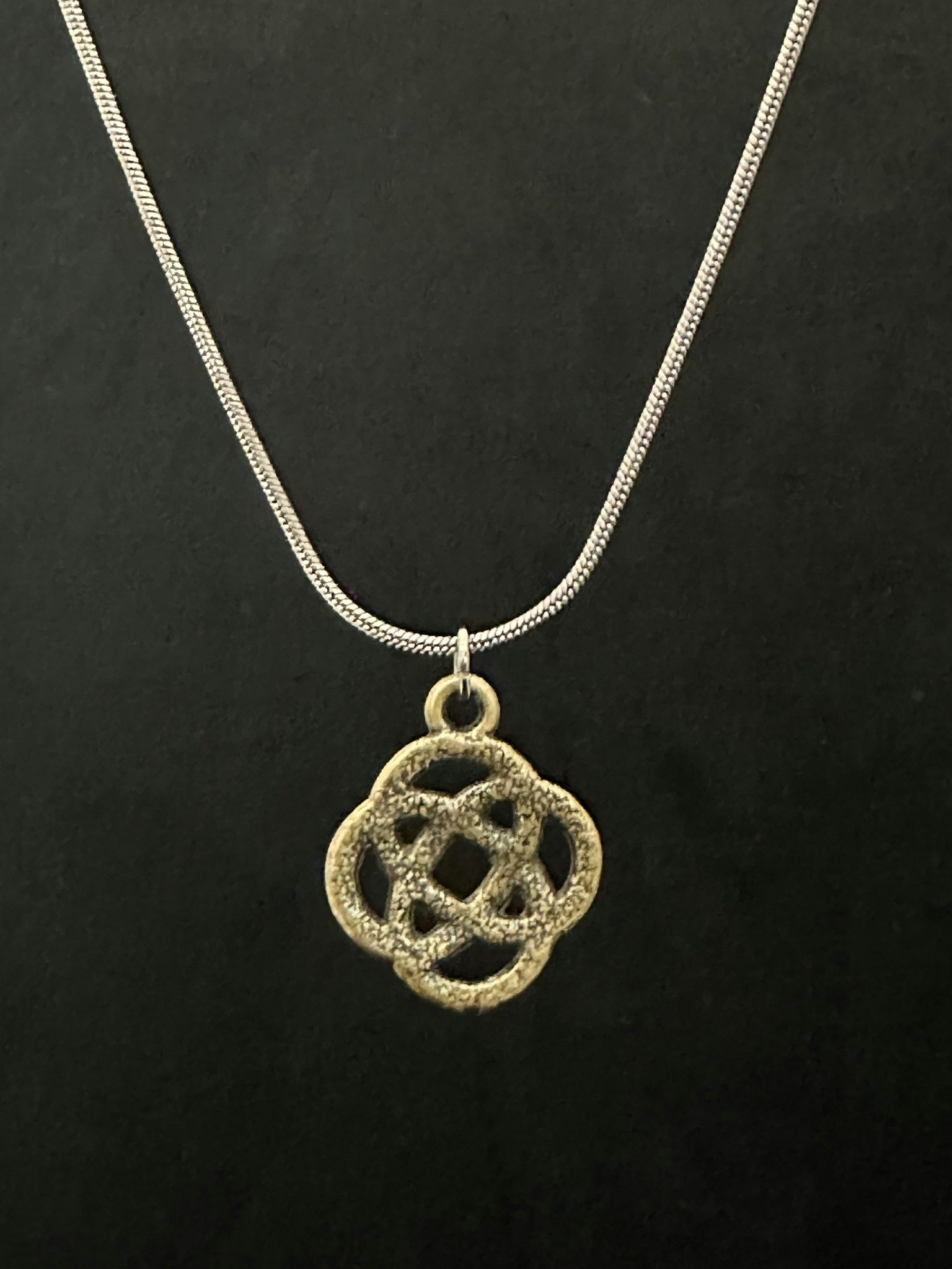Knot charm necklace