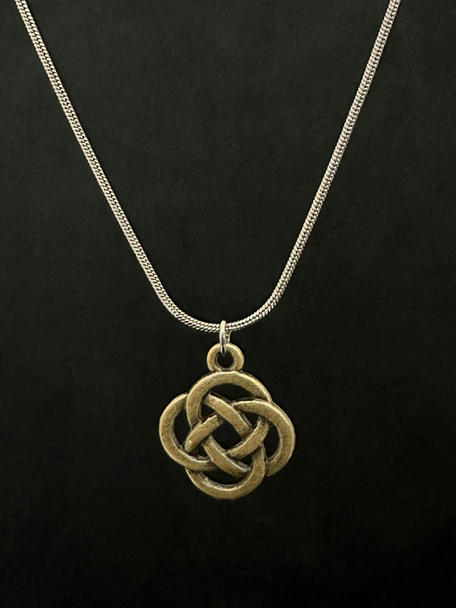 Knot charm necklace