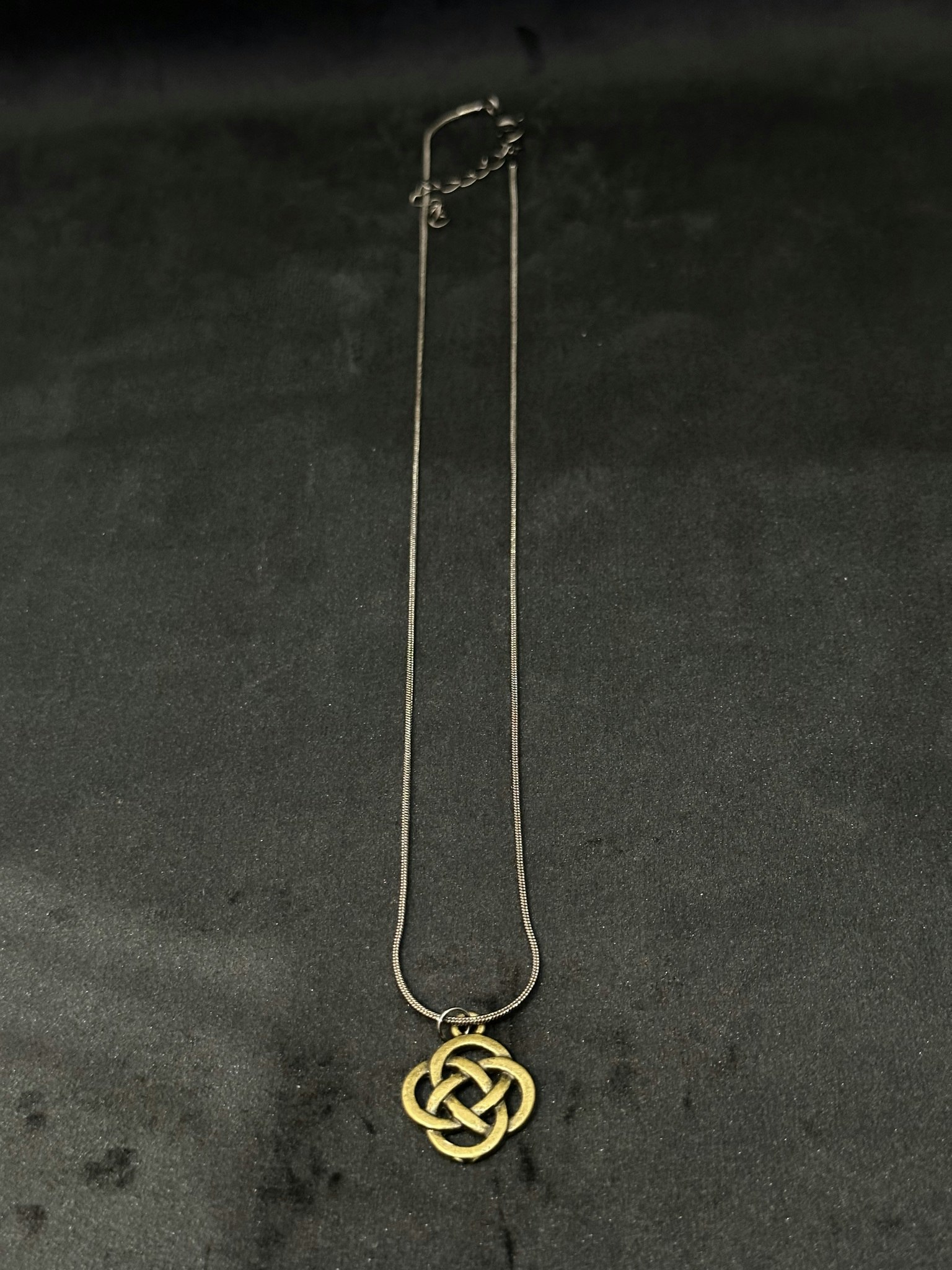 Knot charm necklace