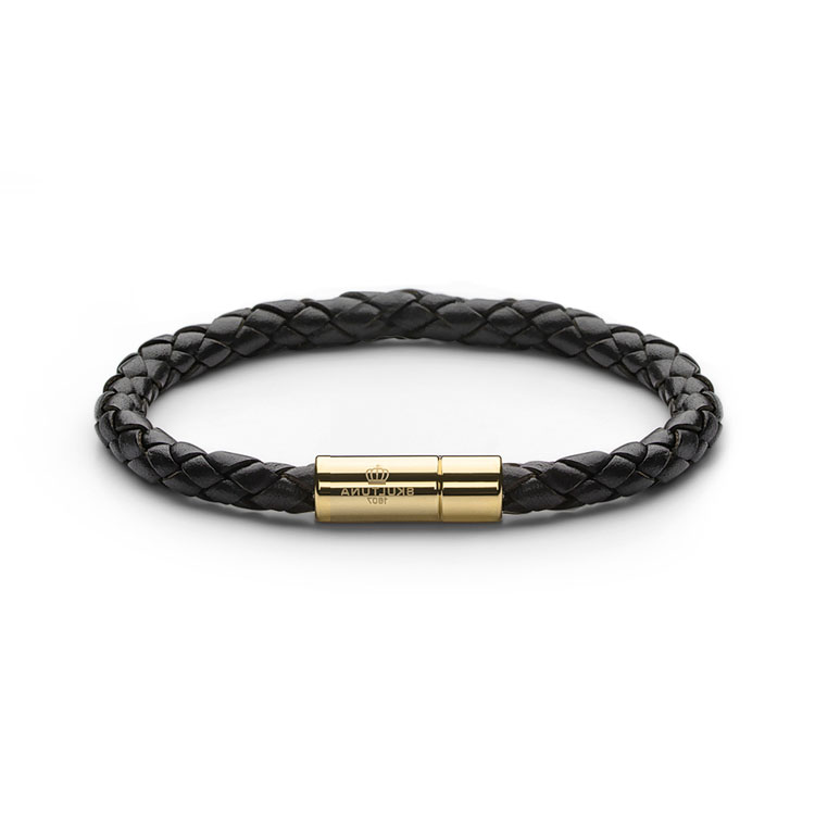 Skultuna Leather Bracelet Gold Black, armband med flätat läder i svart och guldpläterad mässing.