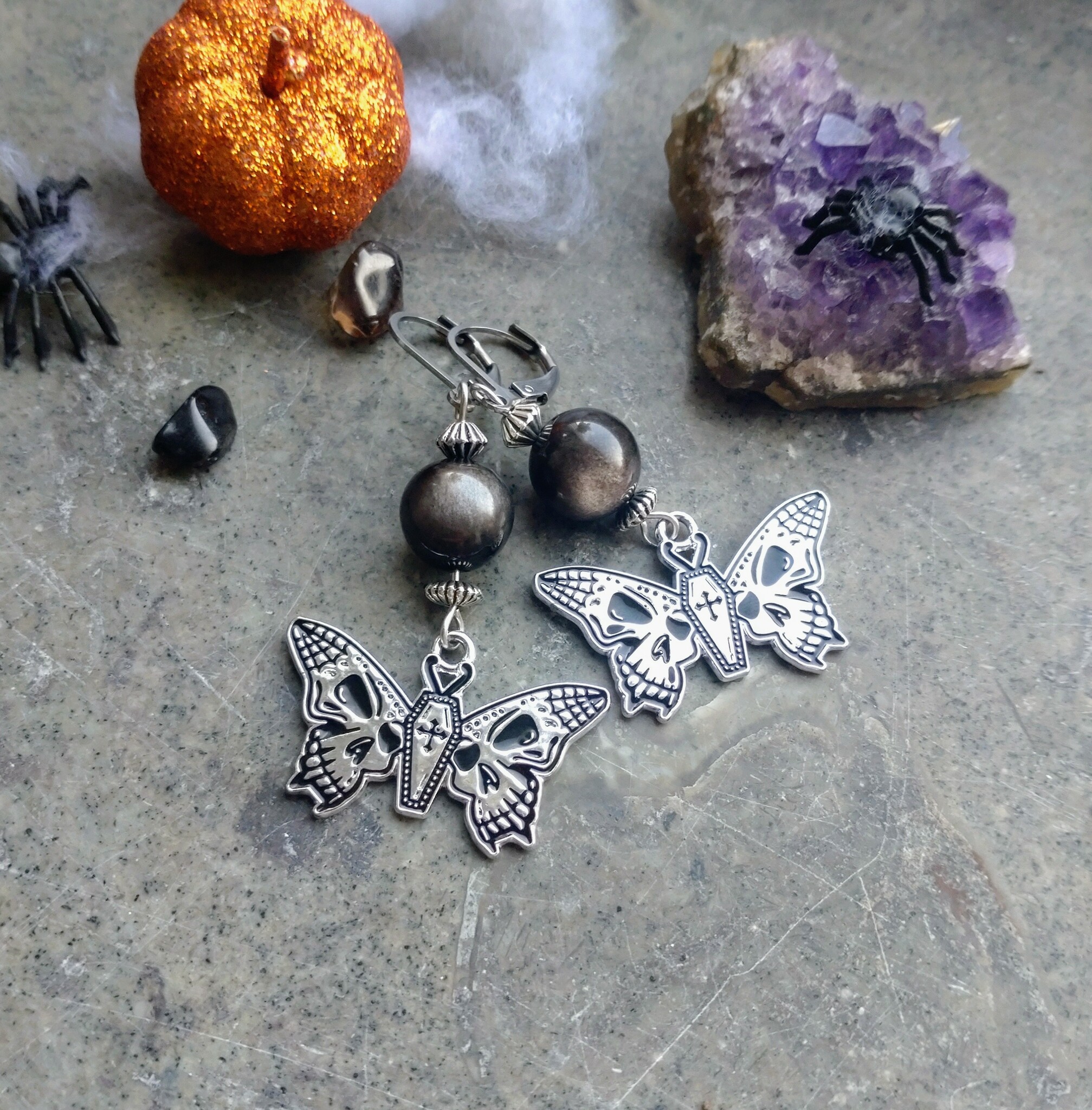 Örhängen Butterfly Skull med Silverobsidian och silverfärgade detaljer