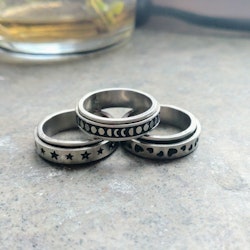 Rostfri spinner/stressring i tre designer