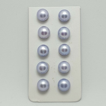 Button formade ljusblå pärlor 8-8,5 mm