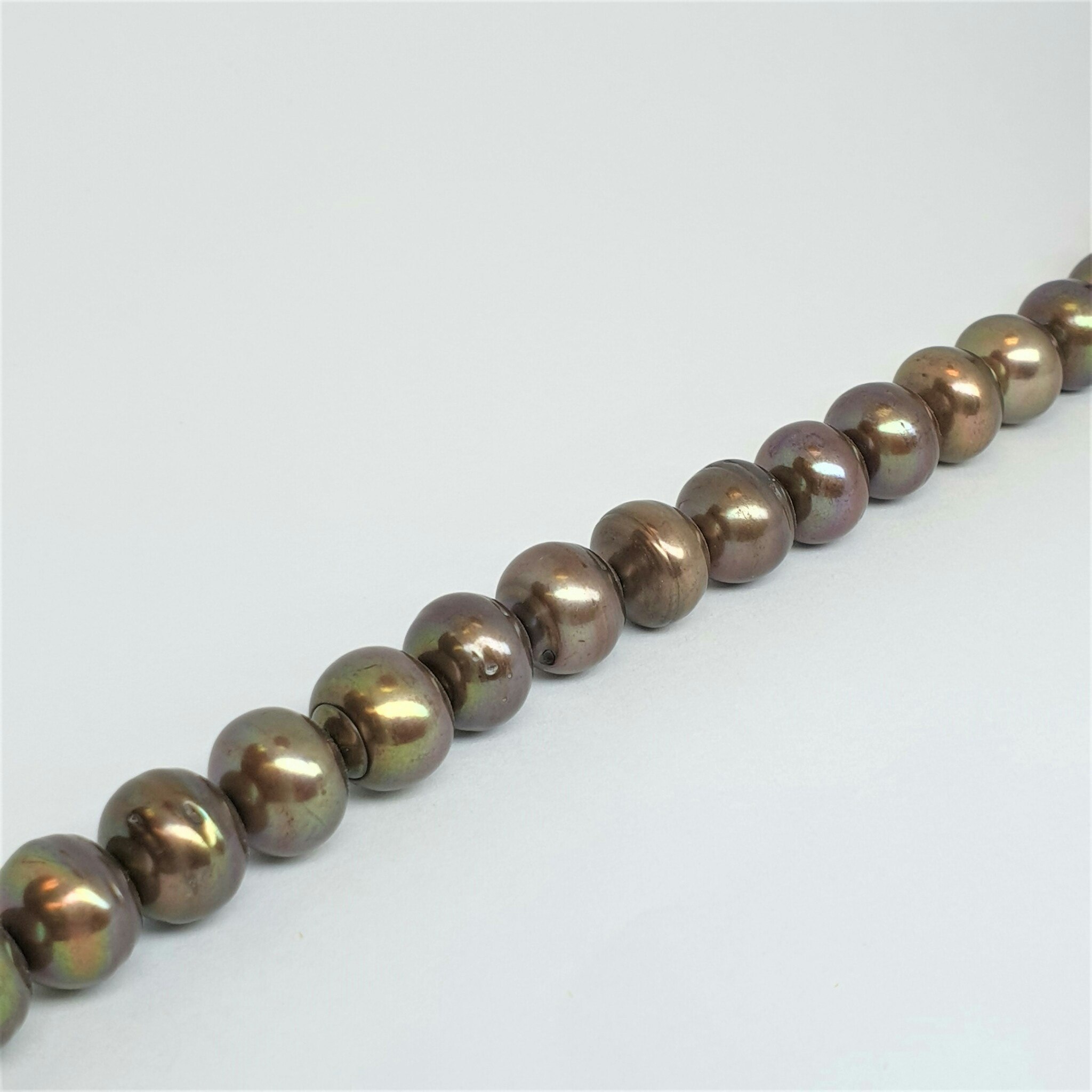 Runda brun-oliv 11-12 mm pärlor