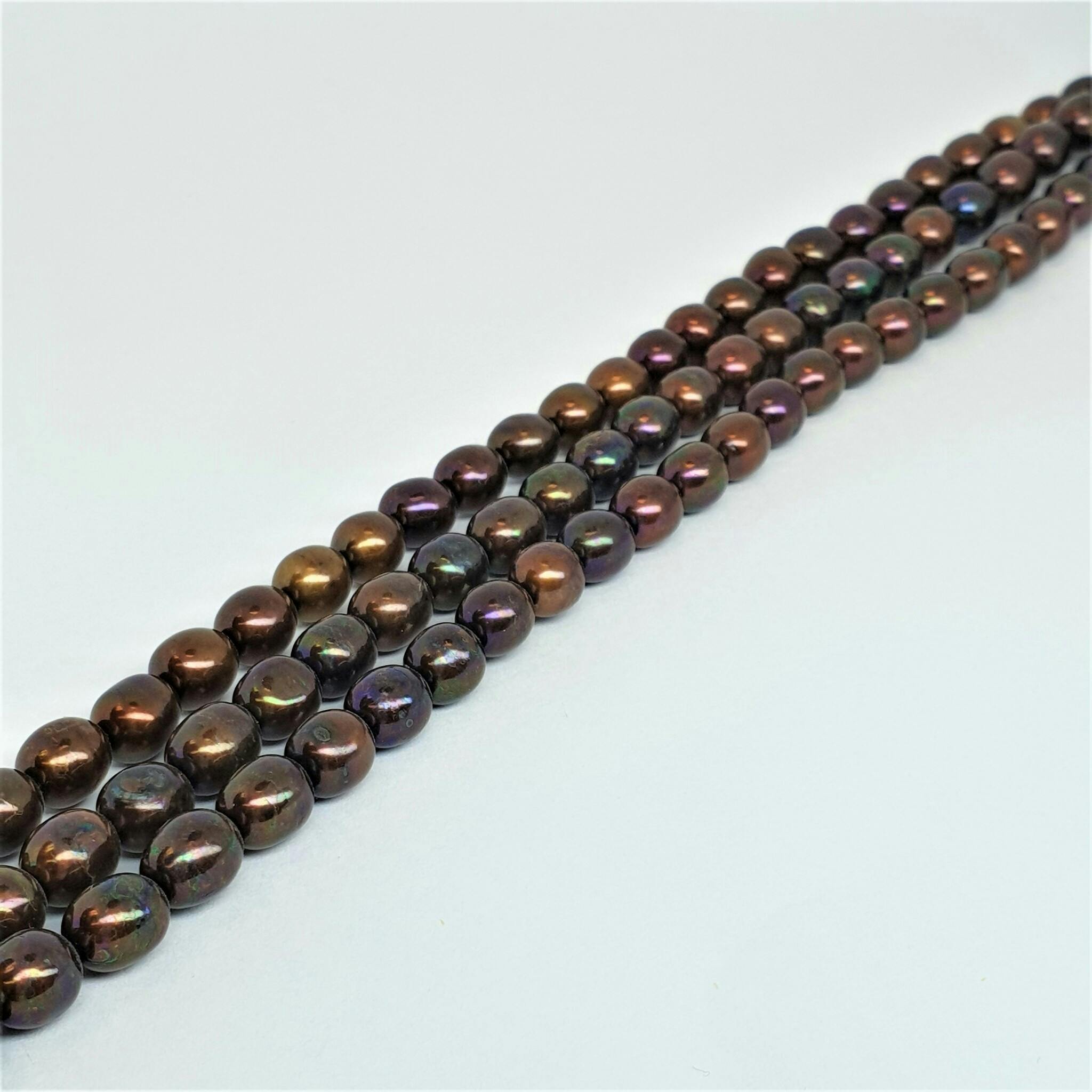 Brun-röda ovala pärlor 6,5-7 mm