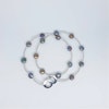 Halsband med blå-violetta 8 mm mynt-pärlor med silverstavar