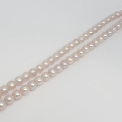Rosa runda naturfärgade pärlor 6-6,5 mm