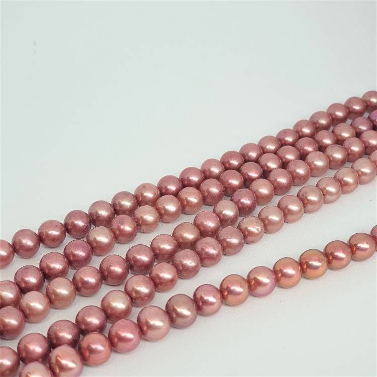 Mörkt rosa pärlor 7-7,5 mm