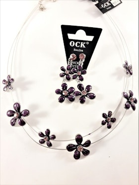 Halsband med lila blommor samt matchande örhängen
