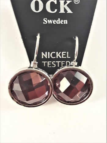 Örhänge med silverfärg och lila facett