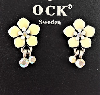 Emaljerat, vitt örhänge i form av fembladig blomma och strass