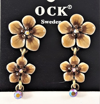Emaljerat, brunt örhänge i form av fembladig blomma med liten blomma och strass