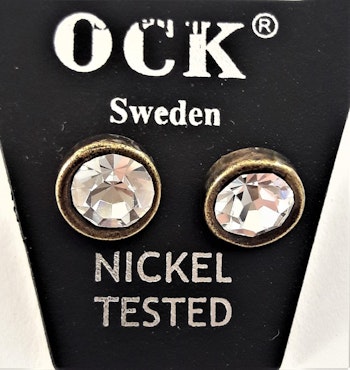 Guldfärgat örhänge, runt med glittrande vit kristall, ca 8 mm
