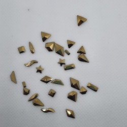Stora guld stenar med silver botten mixade former 28 i påsen