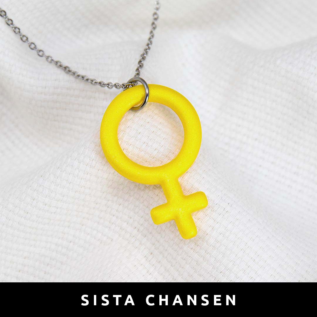 Halsband i form av en venussymbol / kvinnosymbol /feministsymbol, gjort för hand i polymerlera. Färg: gul.