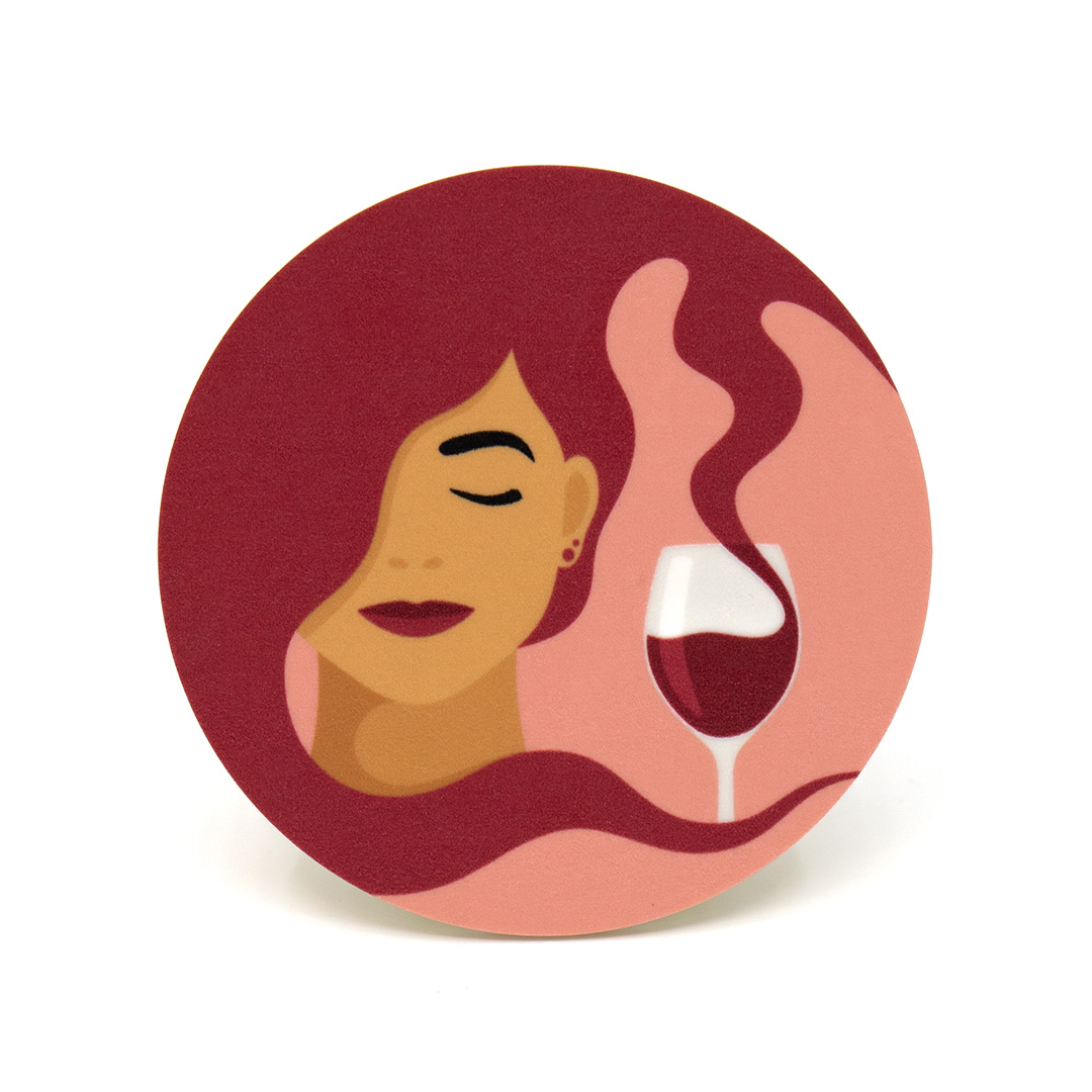 Coaster / glasunderlägg med motivet Tipsy – en kvinna vars hår blir till rödvin som rinner ner i hennes vinglas. Färg: rosa och röd.