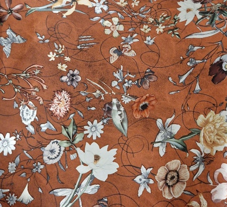 Fuskskinn med blommor och metalliceffekt rostbrun