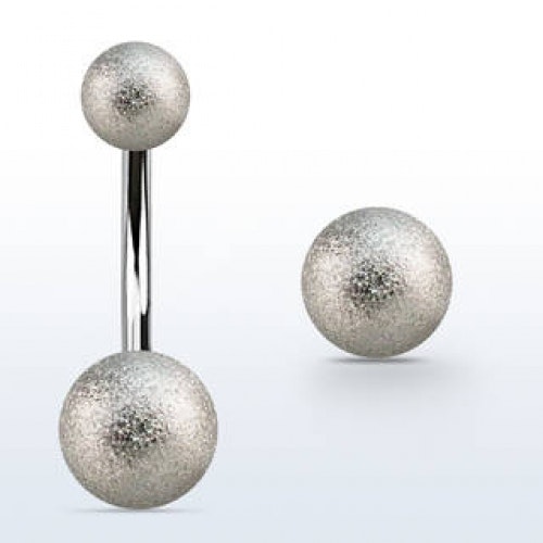 Navelpiercing med exfolierade bollar