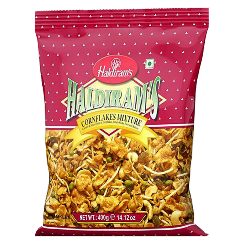 Utforska den unika smaken av Haldiram's Cornflakes Mixture, en perfekt kombination av söta och kryddiga smaker. Denna läckra snacks består av majsflingor, potatispinnar, kaju (cashewnötter) och russin