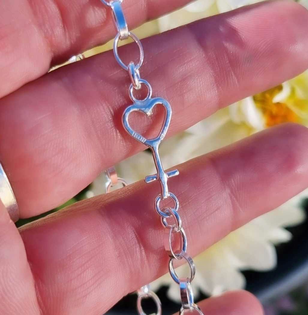 Silver bracelet with women's symbol - heart